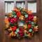 22" Orange & Burgundy Fall Harvest Artificial Floral & Pinecone Wreath